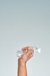 © IC Production - Plastic bottle in hand. Eco business. Ecology concept.