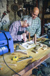 © David Pereiras - Senior couple working in a carpentry workshop