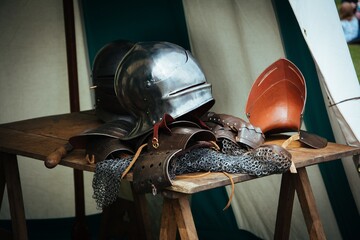 Wall Mural - Clothing and tools of a medieval knight on the table