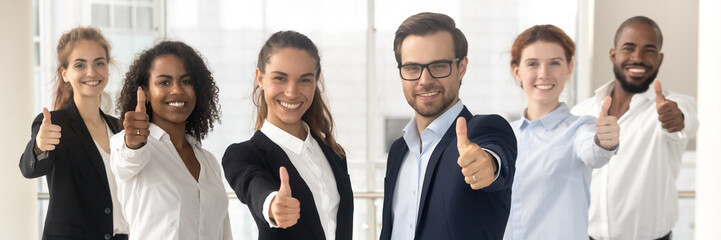 Poster - Group of multi ethnic staff standing in row smiling showing thumbs up hand gesture, concept of career success growth, best corporate service feedback. Horizontal photo banner for website header design