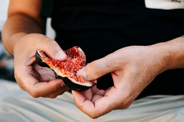 Poster - man about to eat a fig