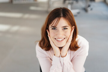 Happy young woman with a lovely friendly smile