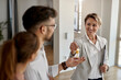 © Drazen - Happy real estate agent giving to couple keys of their new home.