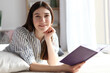 © White bear studio  - Young girl reads a book at home