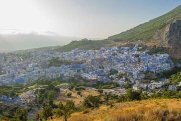 Wall Mural - CHEFCHAOUEN, MOROCCO - Aug 31, 2018: Sunset over the blue Moroccan town of Chefchaouen, as seen from the hill of the Spanish Mosque.