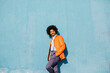 © VISTA by Westend61 - Portrait of stylish man leaning against blue wall