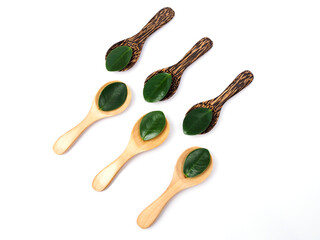 Wall Mural - Wooden spoon with green leaves, Natural wooden utensils Eco-friendly And safe for health