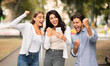 © Prostock-studio - Three Joyful Friends With Cellphone Shaking Fists Celebrating Victory Outdoor