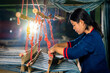 © Thirawatana - Crafts and craftsmanship. Traditional Isan Thai Cotton indigo weaving.  Young woman weaving Cotton Indigo in traditional way at manual loom. Thailand . Selective focus.