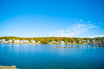 Sticker - Fall colors and New england homes across harbor of Boothbay town and harbor, Maine USA