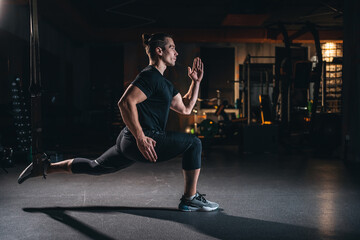 Wall Mural - young man has crossfit workout with roller and weight in gym