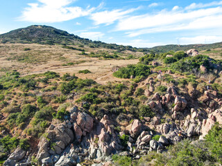 Wall Mural - Aerial view of Los Penasquitos Canyon Preserve with the creek waterfall and people enjoying the water. Urban park with trails and river in San Diego, California. USA