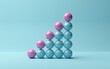 © Shawn Hempel - Pink spheres on rising bar graph of blue spheres on blue background, abstract modern minimal success, growth, progress or achievement concept