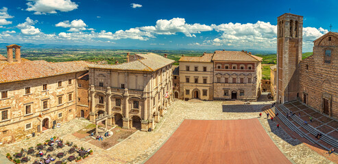 Montepulciano, a medieval and renaissance hill town in  the Italian province of Siena in southern Tuscany, Italy. Panorama view from above to the town and its surroundings.