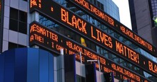A Times Square Stock Market Ticker Displays The "Black Lives Matter" And "I Can't Breathe" Statements. These Phrases Were Commonly Heard In Protests After The Killing By Police In MN.