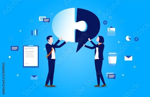 Fotografía Problem solving - Image of two businesspeople at work, piecing together a speech bubble puzzle, with business elements in background