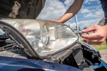 car headlight repair by replacing bad bulbs with new ones