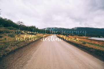 Wild landscape in patagonia , dusty roads going nowhere, with an overlapped text quote it's all about journey not the destination ,travel inspirational background poster