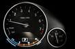 © Nischaporn - Close up of Analog Car dashboard with Tachometer RPM meter and Engine oil temp gauge on background