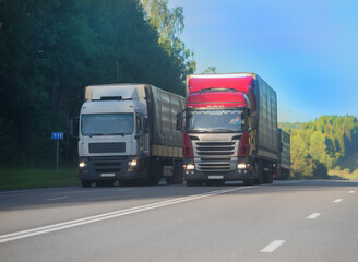 Poster - Trucks moving along a suburban highway