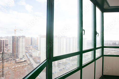 Modern glazed balcony in a Russian house