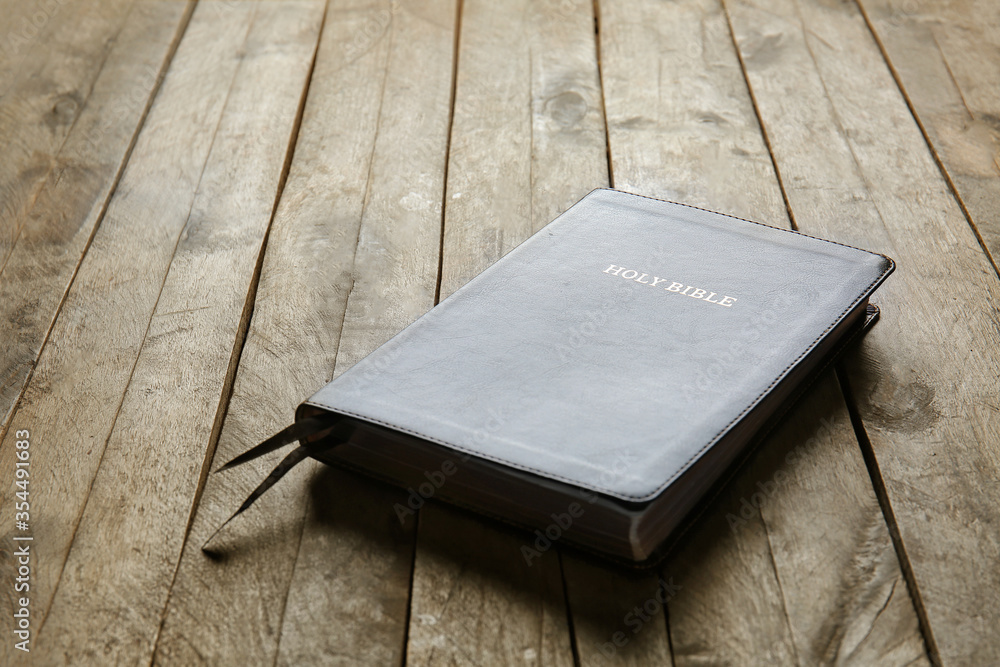 Holy Bible on wooden background