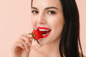 Sticker - Sexy young woman with strawberry on light background