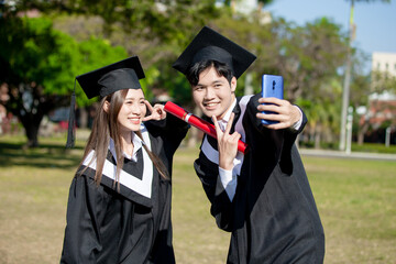 Wall Mural - happy graduate friends take selfie