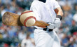 © noraismail - Baseball player hitting ball with bat in close up