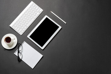 Top view of modern workplace with tablet computer