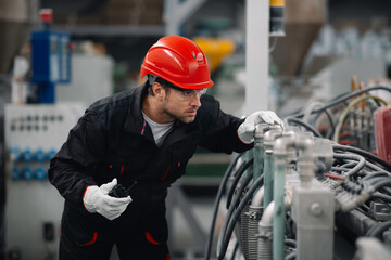 Wall Mural - Portrait of worker in factory.	