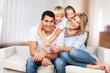 © BillionPhotos.com - Beautiful smiling lovely family sitting on the sofa