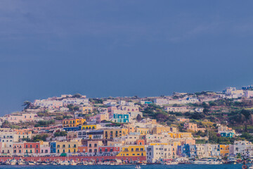 View of the harbor and port at Ponza island in the summer season. The place is typical for its blue water and colorful houses. Ponza is the largest island of the Italian Pontine Islands archipelago.
