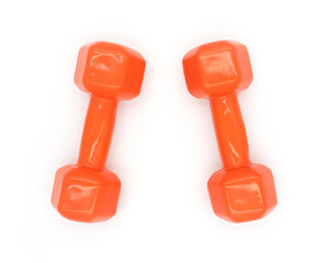 A pair of orange dumbbell isolated on white, top view