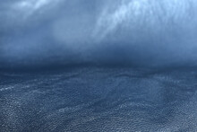 Beautiful Shiny Metallic Blue Grained Leather With Soft Waves, Abstract Texture Or Background, Closeup Veiw, Selective Focus With Blurred Background