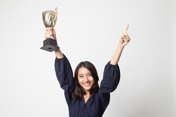 Successful number one winner young asian woman holding a trophy.