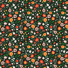 Vector seamless pattern. Pretty pattern in small flower. Small orange flowers. Dark green background. Ditsy floral background. The elegant the template for fashion prints.