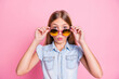 Close-up portrait of her she nice attractive lovely pretty fashionable funny girlish feminine cheery preteen girl touching specs pout lips isolated over pink pastel color background