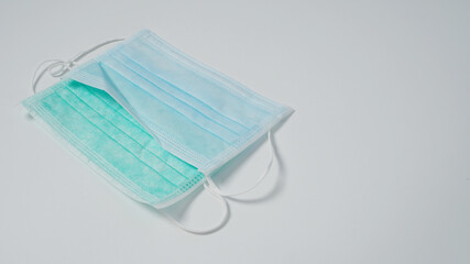 Disposable Ear- loop face mask on white background.