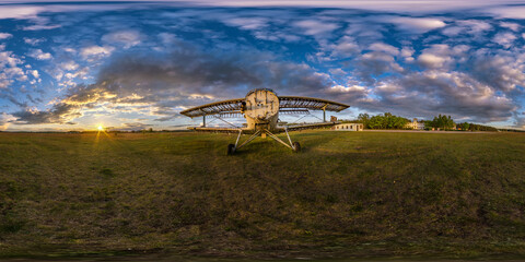 Wall Mural - full seamless spherical hdri panorama 360 degrees angle view among fields near old airplane in summer evening sunset with awesome clouds in equirectangular projection, ready for VR AR virtual reality