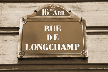 Wall Mural - Paris street sign. Sepia toned vintage filter photo.