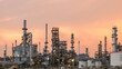 © bannafarsai - Aerial view by drone of oil petrochemical refinery plant during  sunset time