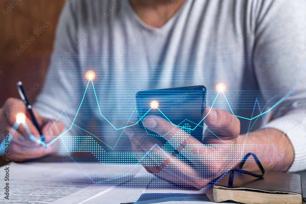 Multi exposure of man signing contract with phone and financial chart ...