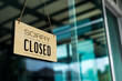 © jumlongch - Label 'Sorry we are closed please come back again' notice sign wood board hanging on door front coffee shop.
