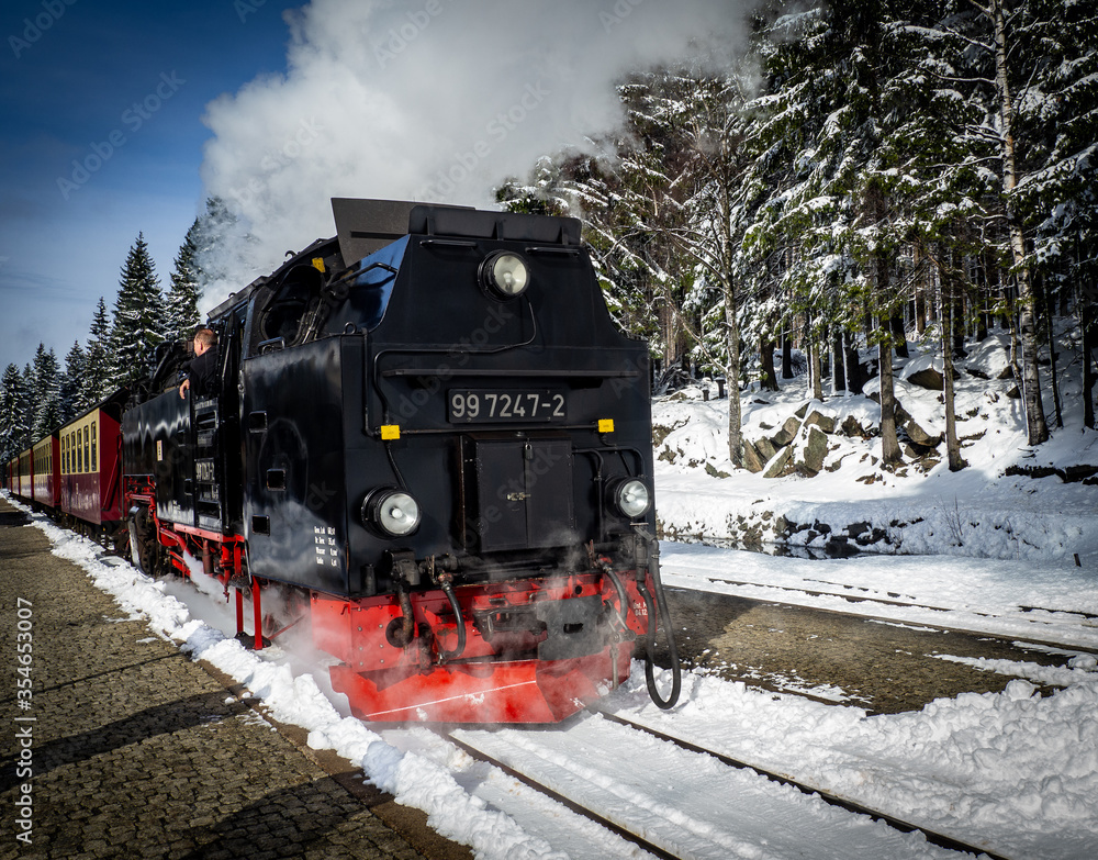 Steam train on the Brocken mountain with snow - obrazy, fototapety, plakaty 