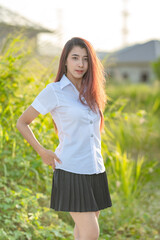 Portrait of asian or thai student university uniform beautiful girl relax and smile