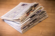 selective focus of the stacking newspapers folded place on wooden table