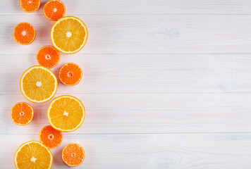 Wall Mural - Citruses on white wooden background