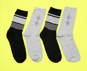 Wall Mural - Men's stylish beautiful socks on a yellow background