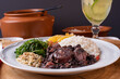 Typical Brazilian dish called Feijoada. Made with black beans, pork and sausage